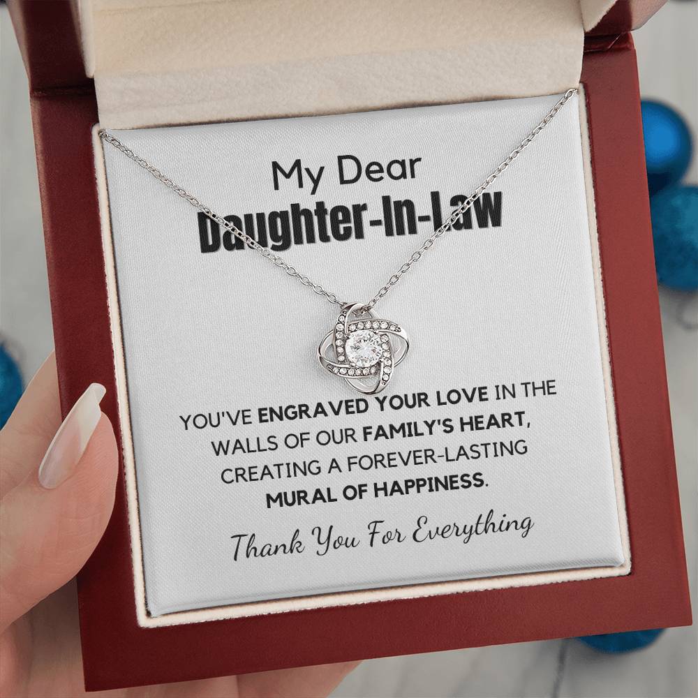 A message card inside a gift box presenting a necklace with a cubic zirconia pendant, intended as a gift for daughter-in-law.